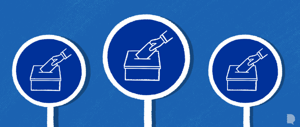 Mains qui déposent leur vote dans des urnes
